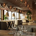 Elegant Modern Restaurant Interior With Decorative Chandeliers Large Windows And Wooden Dining Table