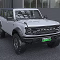 Silver Ford Bronco SUV With Large Off Road Tires And Modern Front Design