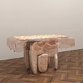 Artistic Dining Table With Patterned Tabletop And Sculptural Legs On Herringbone Wooden Floor