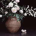 Woven Texture Vase with Pink White Flowers Green Leaves and Scattered Blooms on Dark Background