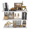 Decorative Ornament Set With Golden Deer Candle Holders Feather Art Frames And Books On Shelf