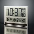 Digital Electronic Clock With Time Date Temperature Display And Sleek Silver Frame On Reflective Surface 3d model