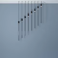 Modern Minimalist Chandelier with Vertical Elongated Black Base Arranged in Slanted Line with Height Differences