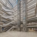 Shopping Mall Lobby With Glass Elevator Staircases And Modern Lighting Design