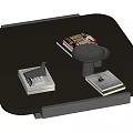 Modern Black Coffee Table With Stacked Books And Small Tray On Top