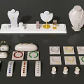 Elegant Jewelry Display With Necklaces On Mannequins Rings In Trays And Bracelets On Stands