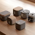 Modern Kitchen Appliances In Various Styles And Colors On Wooden Countertop