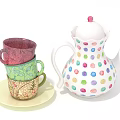 Colorful Polka Dot Teapot With Stacked Patterned Cups On Light Plate