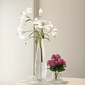 White Lilies in Transparent Ribbed Vase with Pink Chrysanthemums in Small Vase