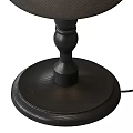 Traditional Carved Wooden Table Lamp With Dark Fabric Shade And Textured Base Design