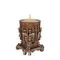 Decorative Carved Candle Holder With Lit Candle And Intricate Ornate Patterns