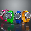 Four Colorful Digital Watches With Pink Green Blue Yellow Straps And Modern Design
