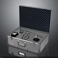 Open Silver Metal Toolbox With Black Checkered Lining And Black Device Pliers Screwdriver Round Pads