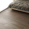 Modern Bedroom Interior Featuring Natural Wood Flooring With Warm Texture And Cozy Bedding