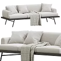 Light Colored Sofa With Soft Cushions And Throw Blanket On Metal Legs 3d model