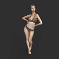 Woman In Brown Bikini Standing And Posing Against Black Background