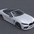 White BMW Convertible Sports Car With Black Top And Stylish Front Design