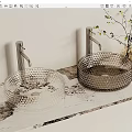 Modern Textured Glass Washbasins With Metallic Faucets And Decorative Plant On Patterned Countertop