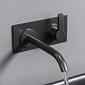 Matte Black Two Handle Wall Mounted Faucet With Water Flowing Over Modern Kitchen Countertop