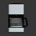 Sleek Modern Black And Silver Coffee Maker With Stainless Steel Body And Glass Carafe