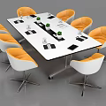 Modern Conference Table with Orange White Top Black White Orange Chairs Notebooks Cups Green Plants