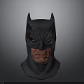 Man Wearing Detailed Batman Mask with Fierce Expression and Dark Design