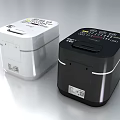 Two Black and White Midea Rice Cookers as Modern Kitchen Appliances with Digital Control Panels