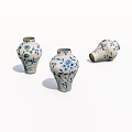 Three Blue and White Ceramic Vases with Floral Patterns on White Background