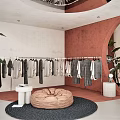 Modern Clothing Store Interior With Clothes On Display Bean Bag And Decorative Plants