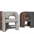 Stylish Modern Accent Chairs With Curved Arms And Brown Throws In Two Tones