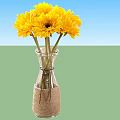 Yellow Flower Bouquet In Clear Glass Vase With Jute Wrapped Bottom For Home Decoration