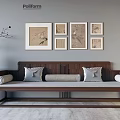 Chinese Style Wooden Sofa Set With Gray Cushions Framed Paintings And Vase On Gray Wall