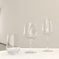 Various Wine Glasses of Different Shapes on White Hexagonal Table White Wall Window Green Plants
