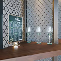 Modern Cafe Interior With Coffee Sign Metal Grid Wall Green Plants Wooden Bar And Black Stools