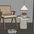 Textured White Stone Side Table with Rattan Chair Bowl of Nuts and Table Lamp