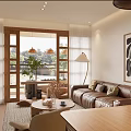 Warm Living And Dining Room With Leather Sofa Wooden Dining Table Decorative Painting And Natural Light