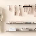 Premium Soft Bathroom Towels Hanging On Wall And Folded On Shelves With Bathrobes And Toiletries
