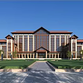 Symmetrical School Building Exterior With Reddish Brown Roof Large Glass Windows And Front Lawn Pathway