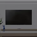 Large Screen Wall Mounted Television On Wooden Stand With Blue Rabbit Figurine And Green Plant