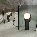 Artistic Modern Table Lamp With Hand Shaped Base And Transparent Glass Shade