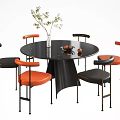 Round Black Marble Top Dining Table Set With Orange Cushioned Chairs And Decorations 3d model