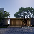 Modern Entrance Gate With Wooden Slats Surrounded By Trees And Lawn