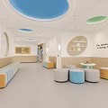 Modern Kindergarten Reception Area Featuring Circular Ceiling Logo Wooden Panels White Desk And Green Plant