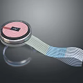 Circular Electronic Device With Pink Display Showing Number 24 And Flexible Ribbon Cable