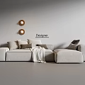 Designer Beige Sectional Sofa With Decorative Pillows Throw Blanket And Gray Wall Circular Decor