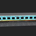 Blue Passenger Train Carriage With Decorative Patterns And Windows On Railway Track 3d model