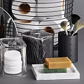 Bathroom Accessories Organized In Black Wire Baskets With Gray Towels Toiletries Mirror And Soap