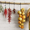 Hanging Various Types of Crops on Wooden Pole Against White Brick Wall
