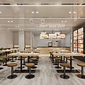 Bright Modern Shop Front Desk With Wooden Tables Round Stools Display Cases And Green Plant