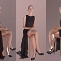 Woman in Black Sleeveless Dress Sitting on Stool with Flowing Skirt and Black High Heels